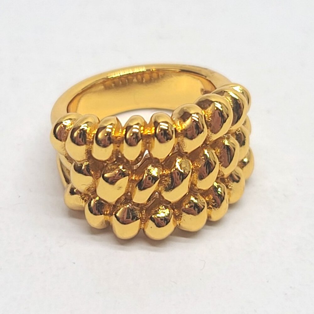 UNOde50 gold tone sculptural modern braid band ring Spanish designer statement